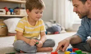 Tata uczy syna, jak nauczyć dziecko kolorów, budując z klocków.