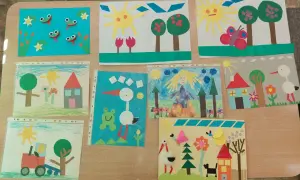 Prace plastyczne z figur geometrycznych: żaby, bociany, domki, słoneczka, traktorek i inne. Dzieci tworzą kolorowe światy.