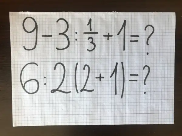 Dwa trudne zadania matematyczne na kartce w kratkę: 9-3:1/3+1=? i 6:2(2+1)=?